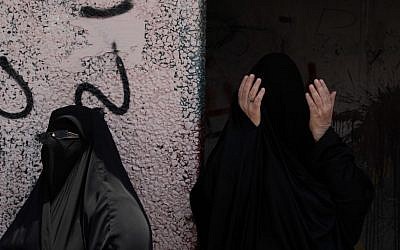 Bahraini anti-government protesters pray for the safety of those involved in civil disobedience during a march in the western village of Malkiya, Bahrain, on Wednesday (photo credit: AP/Hasan Jamali)