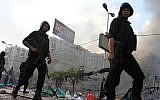 Egyptian security forces clear a sit-in by supporters of ousted Islamist President Mohammed Morsi in the eastern Nasr City district of Cairo, Egypt, on Wednesday, Aug. 14, 2013. (photo credit: AP Photo/Ahmed Gomaa)