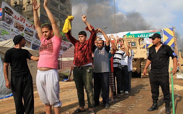 Egyptian security forces detain protesters as they clear a sit-in by supporters of ousted Islamist President Mohammed Morsi in the eastern Nasr City district of Cairo, Egypt, Wednesday, Aug. 14, 2013. (Photo credit: AP/Ahmed Gomaa) Egyptian security forces detain protesters as they clear a sit-in by supporters of ousted Islamist President Mohammed Morsi in the eastern Nasr City district of Cairo, Egypt, Wednesday, Aug. 14, 2013. (Photo credit: AP/Ahmed Gomaa)