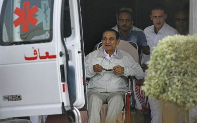 Former Egyptian president Hosni Mubarak, 85, is escorted by medical and security personnel into an ambulance en route from Maadi Military Hospital to the Cairo Police Academy-turned-court, Cairo, Egypt, Sunday, Aug. 25, 2013 (photo credit: AP/Amr Nabil) Former Egyptian president Hosni Mubarak, 85, is escorted by medical and security personnel into an ambulance en route from Maadi Military Hospital to the Cairo Police Academy-turned-court, Cairo, Egypt, Sunday, Aug. 25, 2013 (photo credit: AP/Amr Nabil)
