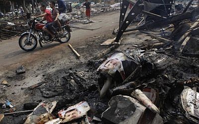 Burnt poster of Egypt's ousted president Mohammed Morsi in Nahda Square, near Cairo University, in Giza, Cairo, Egypt, on Thursday, August 15, 2013 (photo credit: AP/Amr Nabil)