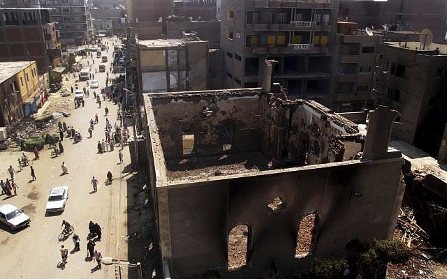 The Evangelical Church of Malawi is left in ruins Saturday, August 17, 2013, after it was ransacked, looted and burned on Thursday by an angry mob, in Malawi, south of Minya, Egypt. In the province of Minya south of Cairo, protesters attacked two Christian churches, security officials said. (photo credit: AP Photo/Roger Anis, El Shorouk Newspaper) The Evangelical Church of Malawi is left in ruins Saturday, August 17, 2013, after it was ransacked, looted and burned on Thursday by an angry mob, in Malawi, south of Minya, Egypt. In the province of Minya south of Cairo, protesters attacked two Christian churches, security officials said. (photo credit: AP Photo/Roger Anis, El Shorouk Newspaper)