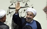 Iranian President Hassan Rouhani waves after his swearing-in ceremony at the parliament, in Tehran, August 4, 2013. (photo credit: AP/Ebrahim Noroozi)