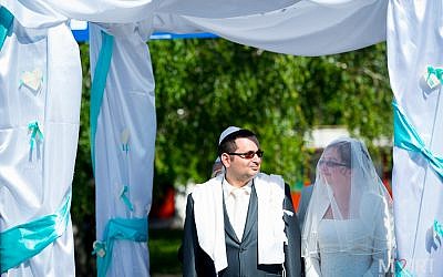Many of us knew that Barbi and Paszternak must become a family one day — much earlier than they did," says the rabbi and former camper who married them. (Marton Karsai via JTA)