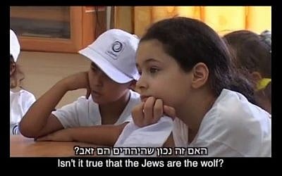 Palestinian children in the Balata refugee camp at storytime in a summer camp run by the United Nations Relief Works Agency. (photo credit: Youtube/ screengrab)