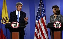 US Secretary of State John Kerry, left, speaks as Colombia's Foreign Minister Maria Angela Holguin looks on during a joint news conference in Bogota, Colombia, on Monday. (photo credit: AP/Fernando Vergara)
