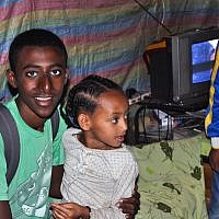 Buyota Mengisto with his niece (photo credit: Michal Shmulovich/ToI)