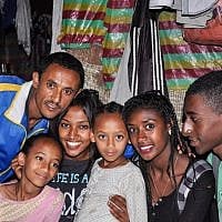 Damaka Mengisto, left, with his two young daughters and their three relatives (from left: Maggie, Zahava, and Buyota) who were visiting Ethiopia from Israel on a Jewish Agency-sponsored trip, Samai, last December (photo credit: Michal Shmulovich/ToI)