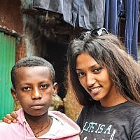 After she discovers she has a half-brother in Gondar, Maggie Mengisto meets him for the first time (photo credit: Michal Shmulovich/ToI)