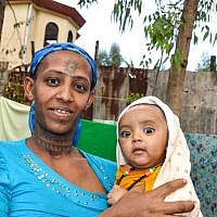 Damaka Mengisto's wife and their newborn baby (photo credit: Michal Shmulovich/ToI)