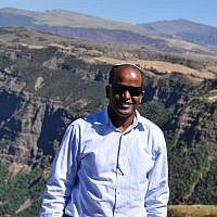 David Mihret with a view of the Simian mountains, which many Ethiopian-Jews crossed to get to Sudan, and then Israel, when fleeing war and famine in Ethiopia during the 1980s (photo credit: Michal Shmulovich/ToI)