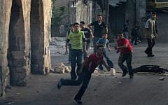 Palestinian youths riot in the West Bank (illustrative photo: Wagdi Ashtiyeh/Flash90)