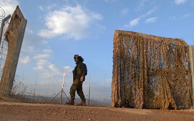 A soldier at the border fence between Israel and Lebanon (photo credit: Hamad Almakt/Flash 90) A soldier at the border fence between Israel and Lebanon (photo credit: Hamad Almakt/Flash 90)