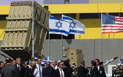 Then-US president Barack Obama and Prime Minister Benjamin Netanyahu alongside an Iron Dome missile defense battery during Obama's visit to Israel in March 2013. (Nati Shohat/Flash90)