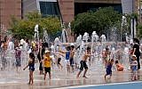 Israeli children play in a water park in Beer Sheva in June. Starting Tuesday, Israeli families will receive fewer shekls for their children due to a cut in the Child Benefit Allowance (photo credit: Flash90)
