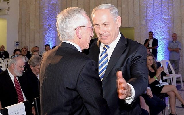 Prime Minister Benjamin Netanyahu embraces outgoing Bank of Israel Chairman Stanley Fischer during his farewell reception in Jerusalem on June 23, 2013 (Photo credit: Kobi Gideon / GPO /Flash90) Prime Minister Benjamin Netanyahu embraces outgoing Bank of Israel Chairman Stanley Fischer during his farewell reception in Jerusalem on June 23, 2013 (Photo credit: Kobi Gideon / GPO /Flash90)