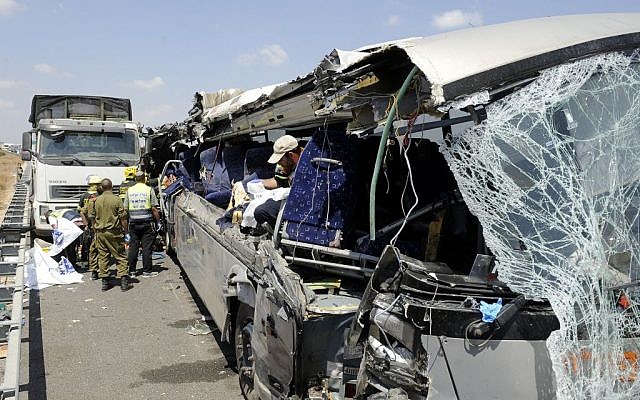 Police and rescue personnel seen at the site of an accident that left four people dead and dozens injured after a bus and a garbage truck collided on Route 6, Sunday, August 4, 2013 (photo credit: David Buimovitch/Flash90) Police and rescue personnel seen at the site of an accident that left four people dead and dozens injured after a bus and a garbage truck collided on Route 6, Sunday, August 4, 2013 (photo credit: David Buimovitch/Flash90)