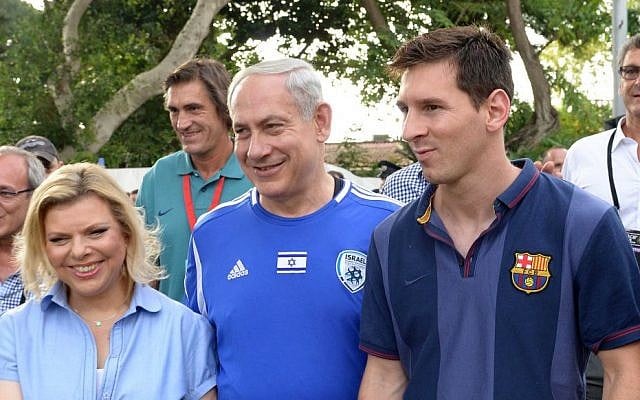 Prime Minister Benjamin Netanyahu and his wife, Sara, walk alongside FC Barcelona superstar Lionel Messi, Sunday, August 4, 2013 (photo credit: Avi Ohayon/GPO/Flash90)