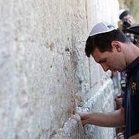FC Barcelona football player Lionel Messi at the Western Wall with the FC Barcelona team in Jerusalem's Old City, August 4, 2013. (Alex Kolomoisky/Flash90)