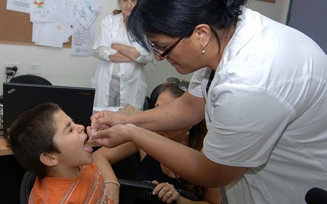 Illustrative: A child receives the polio vaccine at the Health Ministry office in Beersheba on August 5, 2013. (Dudu Greenspan/Flash90) Illustrative: A child receives the polio vaccine at the Health Ministry office in Beersheba on August 5, 2013. (Dudu Greenspan/Flash90)