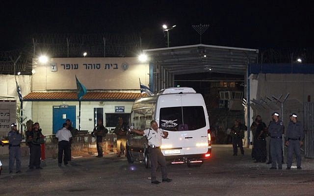 A bus with 12 Palestinian prisoners arriving at Ofer Prison Tuesday night. (photo credit: Flash90)