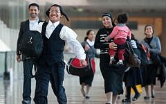 An Orthodox family from Yemen arriving in Israel Wednesday. (photo credit: Moshik Brin/The Jewish Agency/Flash90)