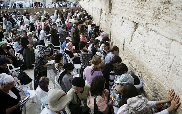 Women seen praying in the women's section of the Western Wall, August 25, 2013. (photo credit: Miriam Alster/Flash90)