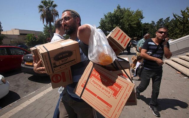 Distribution centers for gas masks were inundated in late August with Israelis trying to get their gas masks as Western intervention in Syria looked likely (photo credit: Roni Schutzer/Flash90) Distribution centers for gas masks were inundated in late August with Israelis trying to get their gas masks as Western intervention in Syria looked likely (photo credit: Roni Schutzer/Flash90)