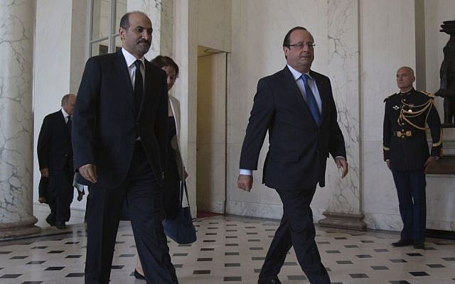 Head of the Syrian National Coalition, Ahmad al-Jarba, left, and France's President Francois Hollande walk in the lobby of the Elysee Palace at the end of August (photo credit: AP/Michel Euler) Head of the Syrian National Coalition, Ahmad al-Jarba, left, and France's President Francois Hollande walk in the lobby of the Elysee Palace at the end of August (photo credit: AP/Michel Euler)