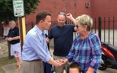 Massachusetts gubernatorial candidate Steve Grossman greeting a spectator at the Bunker Hill Day Parade in Charlestown, Mass., June 2013. (photo credit: Steve Grossman Campaign/JTA) Massachusetts gubernatorial candidate Steve Grossman greeting a spectator at the Bunker Hill Day Parade in Charlestown, Mass., June 2013. (photo credit: Steve Grossman Campaign/JTA)