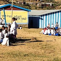 Groups of pupils wait for the teens visiting from Israel to stop by the school (photo credit: Michal Shmulovich/ToI)