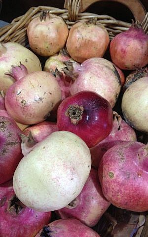 A basket of organic pomegranates at Melo Hatene (photo credit: Jessica Steinberg) A basket of organic pomegranates at Melo Hatene (photo credit: Jessica Steinberg)