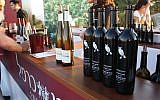 File: Bottles ready to be poured at the tenth annual Israeli Wine Tasting Festival at the Israel Museum (Sarah Sheafer)