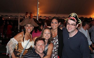 The author, right, is among the Jewish singles enjoying a pirate-themed dinner and party at the Club Getaway. (Club Getaway via JTA)