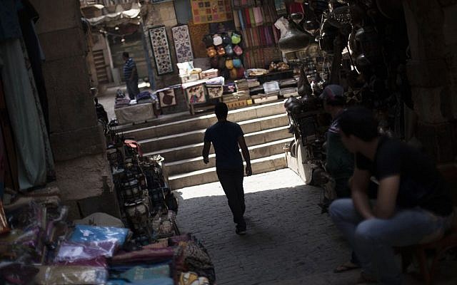 An Egyptian man walks through an empty alley in the Khan El-Khalili market, normally a popular tourist destination, in Cairo, Egypt, Wednesday, August 21, 2013. Riots and killings that erupted across the country after the crackdown against followers of ousted President Mohammed Morsi have delivered a severe blow to Egypt's tourism industry. (photo credit: AP Photo/Manu Brabo) An Egyptian man walks through an empty alley in the Khan El-Khalili market, normally a popular tourist destination, in Cairo, Egypt, Wednesday, August 21, 2013. Riots and killings that erupted across the country after the crackdown against followers of ousted President Mohammed Morsi have delivered a severe blow to Egypt's tourism industry. (photo credit: AP Photo/Manu Brabo)