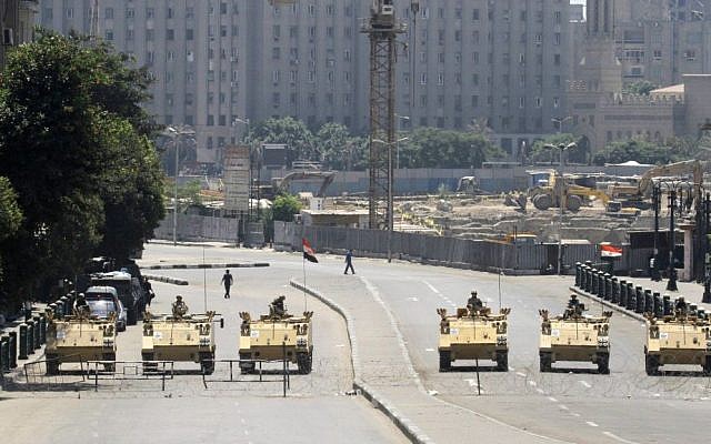 Egyptian army soldiers in armored vehicles block Tahrir Square in Cairo, Egypt, ahead of expected mass rallies, on August 23, 2013 (photo credit: AP/Amr Nabil) Egyptian army soldiers in armored vehicles block Tahrir Square in Cairo, Egypt, ahead of expected mass rallies, on August 23, 2013 (photo credit: AP/Amr Nabil)