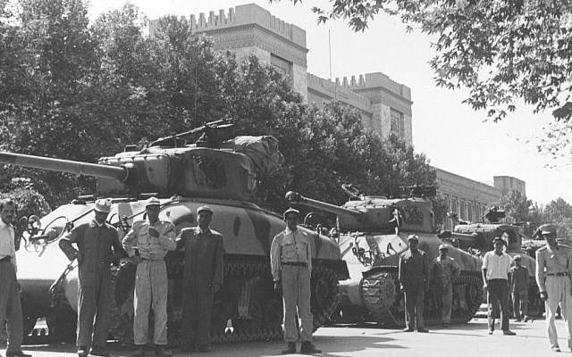 In this August 16, 1953 file photo, Iranian army troops and tanks stand in front of Central Police headquarters after the attempted coup d'etat against Iranian premier Mohammad Mossadeq in Tehran, Iran. (photo credit: AP Photo, File) In this August 16, 1953 file photo, Iranian army troops and tanks stand in front of Central Police headquarters after the attempted coup d'etat against Iranian premier Mohammad Mossadeq in Tehran, Iran. (photo credit: AP Photo, File)