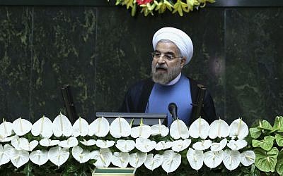 Iran's new President Hasan Rouhani speaks after his swearing-in at the parliament in Tehran, Iran on Sunday, Aug. 4, 2013. (photo credit: Ebrahim Noroozi/AP)