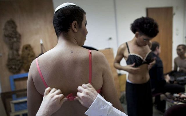 Orthodox Jew Shahar Hadar gets dressed as he prepares for a show at a drag queen school in downtown Tel Aviv, Israel, June 18, 2013. (photo credit: AP/Oded Balilty)