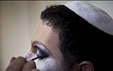 Israeli Orthodox Jew Shahar Hadar has his makeup applied before a show at a drag queen school in downtown Tel Aviv, Israel, Tuesday, June 18, 2013. (photo credit: AP/Oded Balilty)