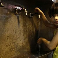A girl whose family fled their home because of Syria’s civil war runs water for drinking in the kitchen of the Kertaj Hotel in Damascus, Syria. Around a dozen families living for months in the Kertaj Hotel and say it has become like a home to them. (Photo credit: AP/Hassan Ammar) A girl whose family fled their home because of Syria’s civil war runs water for drinking in the kitchen of the Kertaj Hotel in Damascus, Syria. Around a dozen families living for months in the Kertaj Hotel and say it has become like a home to them. (Photo credit: AP/Hassan Ammar)