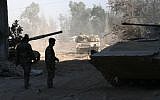 In this photo taken on a government organized media tour, Syrian army soldiers are seen deployed in the Jobar neighborhood of Damascus, Syria, Saturday, Aug. 24, 2013 (photo credit: AP)