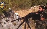 A rebel fighter fires a gun in a valley in an unidentified location in Latakia province, Syria, August 11, 2013 (photo credit: AP)