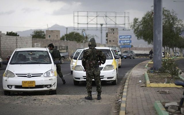 Police stop cars at a checkpoint near the US embassy in Sanaa, Yemen, in August 2013 (photo credit: AP/Hani Mohammed)