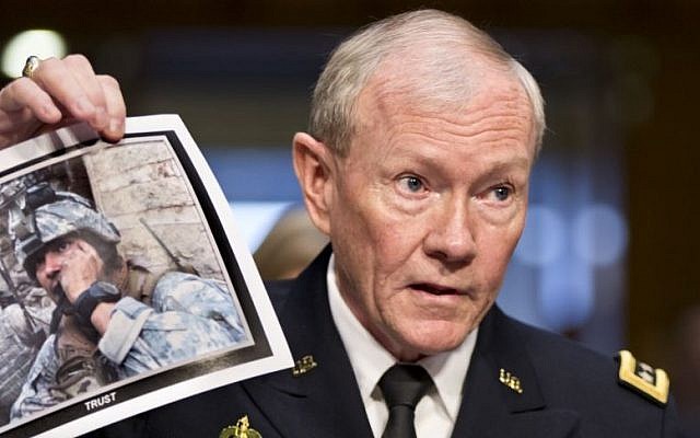 Gen. Martin Dempsey, chairman of the Joint Chiefs of Staff, holds up a photo of a deployed American soldier as he testifies before the Senate Armed Services Committee at his reappointment hearing, on Capitol Hill in Washington. July 18, 2013. (photo credit: AP/J. Scott Applewhite) Gen. Martin Dempsey, chairman of the Joint Chiefs of Staff, holds up a photo of a deployed American soldier as he testifies before the Senate Armed Services Committee at his reappointment hearing, on Capitol Hill in Washington. July 18, 2013. (photo credit: AP/J. Scott Applewhite)