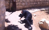 Avrohom Mondrowitz, indicted for child rape in NY, climbs to his feet after being shoved to the ground by an unknown assailant in Jerusalem. (photo credit: Youtube/ screengrab)