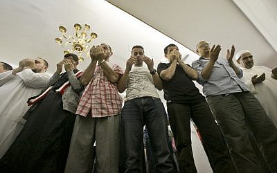 Members of a Muslim congregation pray during a service at the Islamic Society of Bay Ridge mosque in Brooklyn, NY, earlier this month (photo credit: AP/Bebeto Matthews)