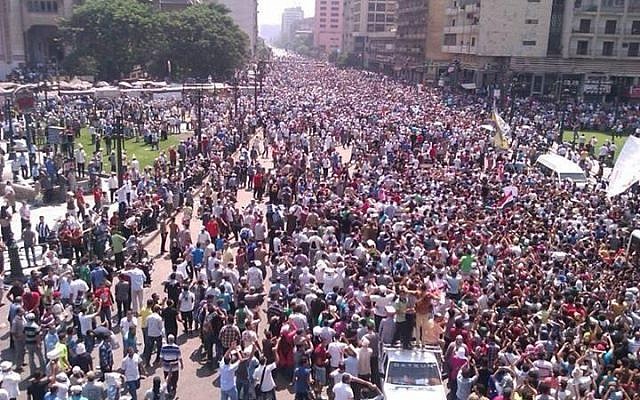 Thousands gathering in Cairo's Ramses Square on Friday (photo credit: GilandMahesa via Twitter)
