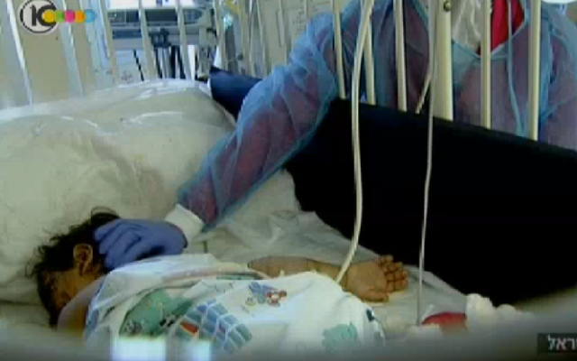 A young Syrian girl undergoes treatment in an Israeli hospital this summer (photo credit: Channel 10 screenshot)