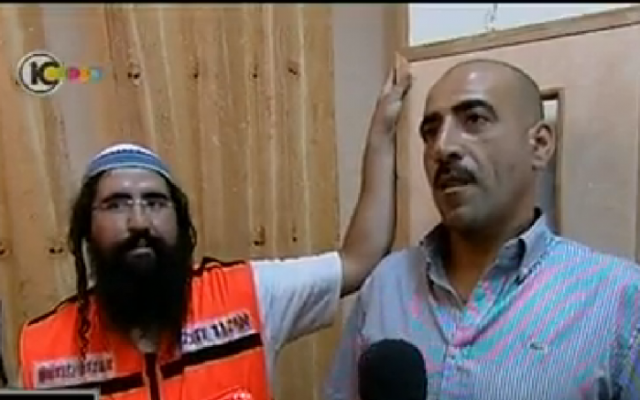 Haim Attias, a medic and a settler, and Haitham Azloni, an Arab resident of East Jerusalem whose life he saved, meet in Jerusalem. (photo credit: screenshot Channel 10 News) Haim Attias, a medic and a settler, and Haitham Azloni, an Arab resident of East Jerusalem whose life he saved, meet in Jerusalem. (photo credit: screenshot Channel 10 News)